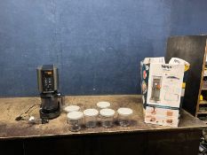 A NINJA CREAMI DELUXE ICE CREAM MAKER with tatty original box, seven pots and six lids (PAT pass and