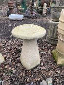 TWO CONCRETE STADDLE STONES with tops, height 66cm Condition Report no obvious damage