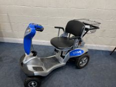 A TZORA TITAN MOBILITY SCOOTER with two keys, charger and rear basket (PAT pass and working but