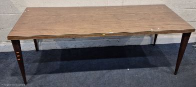 A MID-CENTURY RECTANGULAR DINING TABLE, raised on teak square tapered legs, length 200cm x depth