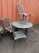 A CAST ALUMINIUM GARDEN TABLE with four matching chairs, table 110cm in diameter Condition Report;