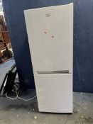 A BEKO CXFG1552W FRIDGE FREEZER, width 55cm, depth 60cm, height 151cm (PAT pass and working at 3 and