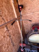 AN ECHO SRM-2600 PETROL STRIMMER with strap (engine pulls freely but hasn't been started)