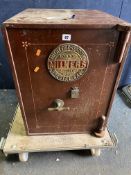 A VINTAGE MILNER SAFE CO. SPECIAL SAFE with one key, width 49cm, depth 52cm, height 64cm (trolley