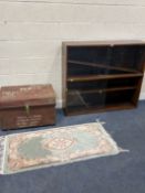 A OAK TWO-TIER BOOKCASE, with glass doors, width 121cm x depth 27cm x height 107cm, a tin trunk