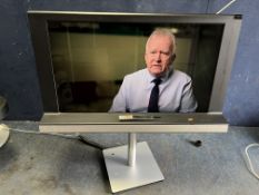 A BANG & OLUFSEN BEOVISION 8-32 TV with a 32-inch screen, built-in soundbar and remote (PAT pass and