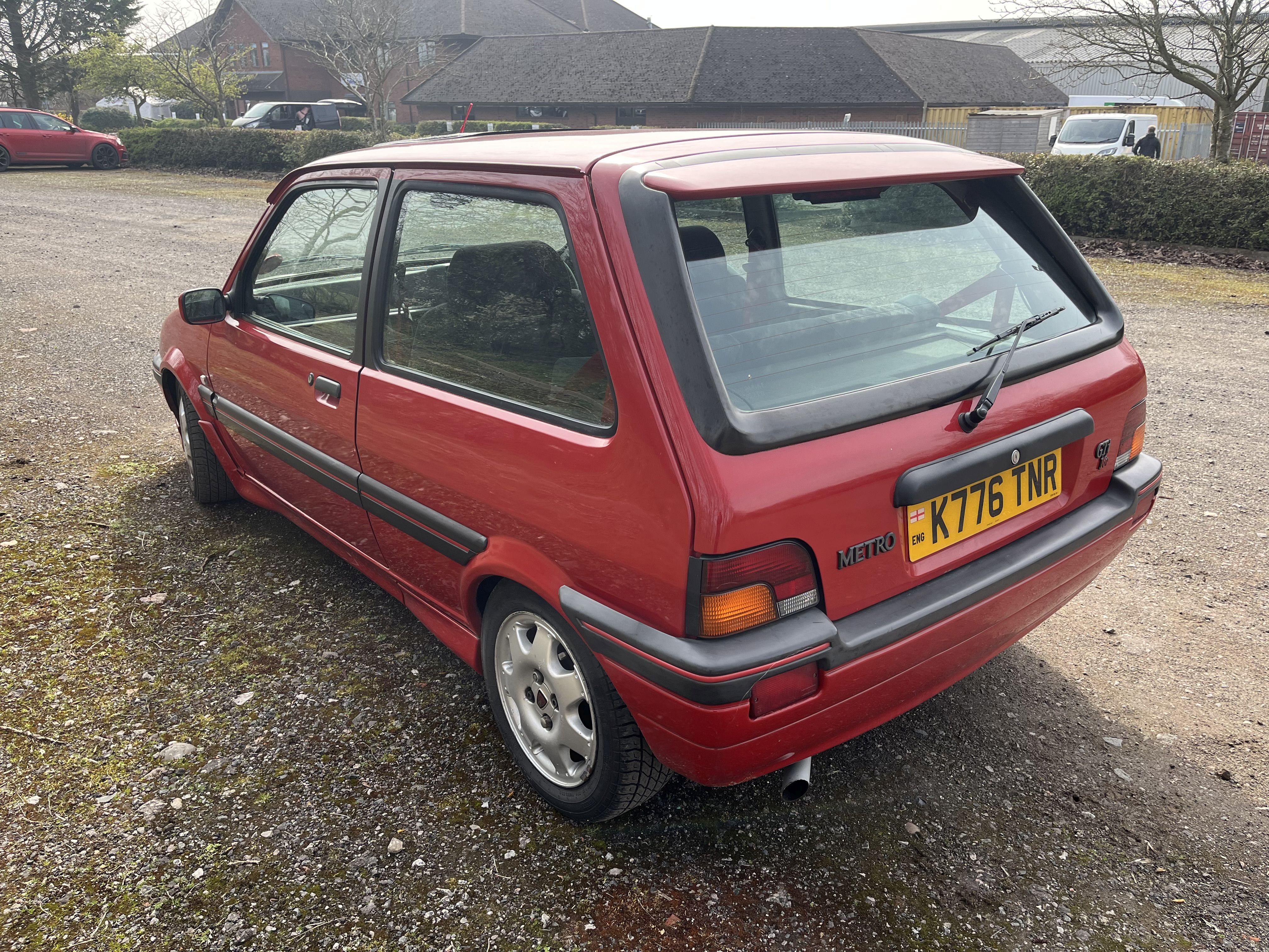A 1993 ROVER METRO GTi 16V THREE DOOR HATCHBACK CAR in red with a ...
