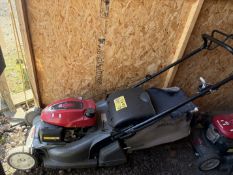A HONDA HRX 476 PETROL SELF-PROPELLED LAWNMOWER, with a grass box, condition report: engine turns