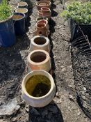A SELECTION OF TERRACOTTA PLANT POTS AND PLATTERS, the largest being 36cm in diameter (20+)