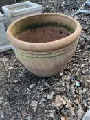 A LARGE TERRACOTTA GARDEN URN with ribbed rim, 60cm in diameter