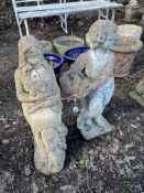 TWO CONCRETE GARDEN FIGURES, one of a lady holding a lamb, the other of a boy holding a basket,