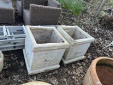 A PAIR OF LARGE SQUARE CONCRETE PLANTERS, with ewers detail to each facet, both 48cm across
