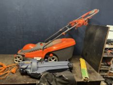 A FLYMO CHEVRON 34C ELECTRIC LAWN MOWER and a Tesco leaf blower/vac (collection bag degraded) (