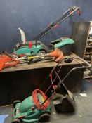 A COLLECTION OF GARDEN TOOLS: including a Bosch Rotak 34C electric lawn mower with a grass box, a