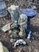 A COLLECTION OF CONCRETE GARDEN ORNAMENTS, including otters, geese, a squirrel, a broken figure of a