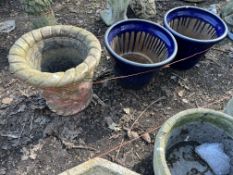 FOUR PLANT POTS, including a concrete planter with lattice detail, 42cm in diameter, a pair of