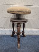 EARLY 20TH CENTURY OAK SWIVEL PIANO STOOL, raised on three legs, diameter 34cm x maximum height 57cm