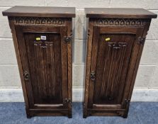 TWO OAK CABINETS, with single linenfold cupboard doors, one enclosing a CD crack, one enclosing