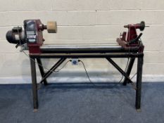 A COBRA WOOD TURNING LATHE, total length 180cm with a box containing plate, two rests etc (PAT