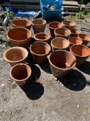 SIXTEEN MODERN TERRACOTTA PLANT POTS, of various sizes and shapes, the largest being, 36cm high,