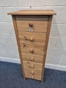 A MODERN PINE CHEST OF SEVEN DRAWERS, width 43cm x depth 41cm x height 126cm, condition report: