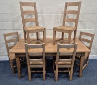 A PINE RECTANGULAR TABLE, with two frieze drawers to one side, raised on square tapered legs, length