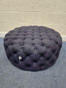 A LARGE CIRCULAR BUTTONED FOOTSTOOL, diameter 90cm x depth 35cm, condition report: was originally