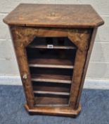 A VICTORIAN WALNUT MUSIC CABINET, with foliate inlay, the single glass door enclosing four