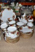 A ROYAL ALBERT 'OLD COUNTRY ROSE' TEA SET consisting of a large cake plate, a teapot, milk jug,