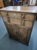 AN OAK DOUBLE DOOR CABINET, with two drawers, width 87cm x depth 50cm x height 122cm, condition