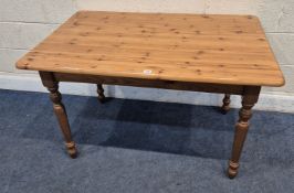 A MODERN PINE RECTANGULAR TABLE, raised on block and turned legs, width 120cm x depth 80cm x
