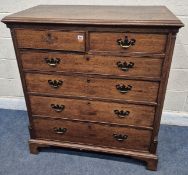 A GEORGIAN OAK CHEST OF TWO SHORT OVER FOUR LONG GRADUATED DRAWERS, raised on bracket feet, width