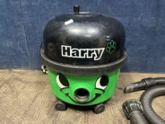 A NUMATIC 'HARRY' VACUUM CLEANER with pipework and floor head (PAT pass and working)