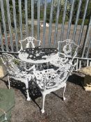 A CAST ALUMINIUM GARDEN TABLE, with four similar chairs and two Victorian wrought iron scrolled