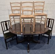 A LATE 20TH CENTURY OAK EXTENDING DINING TABLE, with a single fold out leaf, raised on a single