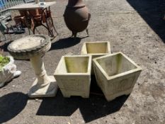 THREE COTSTONE SQUARE CONCRETE PLANTERS, with foliate motif to each facet, 37cm across, and a bird