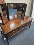 A STAG MINSTREL DRESSING TABLE, with a triple mirror, fitted with six drawers, width 132cm x depth
