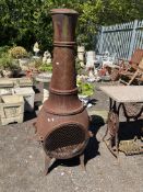 A LARGE CAST IRON CHIMINEA, constructed in three parts ,152cm high. Condition Report: rusty but no