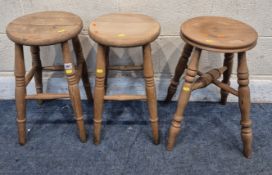 A PAIR AND A SINGLE BEECH STOOL, raised on turned legs, united by stretchers, condition report: