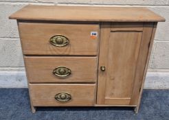 A SMALL CABINET, with three drawers and a single cupboard door, width 70cm x depth 26cm x height