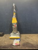 A DYSON DC07 ORIGIN UPRIGHT VACUUM CLEANER with spare filter (PAT pass and working)