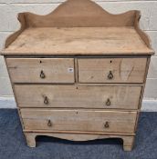 A 19TH CENTURY PINE WASH STAND, with raised back and sides, two short over two long drawers,