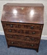 A GEORGIAN MAHOGANY BUREAU, the fall front door enclosing a fitted interior, over four drawers,