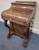 A VICTORIAN BURR WALNUT POP UP DAVENPORT: the pop up section with two drawers, over a hinged lid