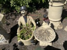 A NOVELTY CONCRETE BIRDBATH AND PLANTER, with a boy on an oyster shell and a man seated behind a