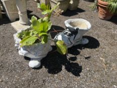 TWO NOVELTY CONCRETE PLANT POTS, in the form of a hollow child's head and a boot, 51cm long (2)