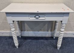 A WHITE PAINTED CONSOLE TABLE, with a single frieze drawer, raised on bobbin turned legs, width 95cm