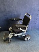A FOLD-A-WHEEL FOLDING ELECTRIC WHEELCHAIR with charger (PAT pass, charges but the chair doesn't