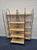 A SET OF THREE SHELVING UNITS, each with five shelves and metal supports, width 75cm x depth 32cm