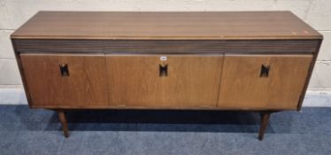 ELLIOTS OF NEWBURY, A MID-CENTURY TEAK SIDEBOARD, fitted with three drawers, over two cupboard doors
